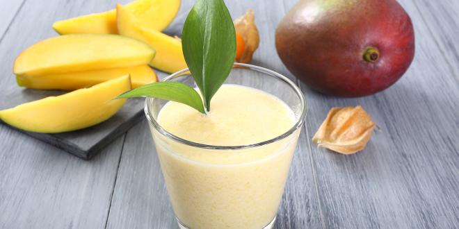 a glass of fresh mango smoothie