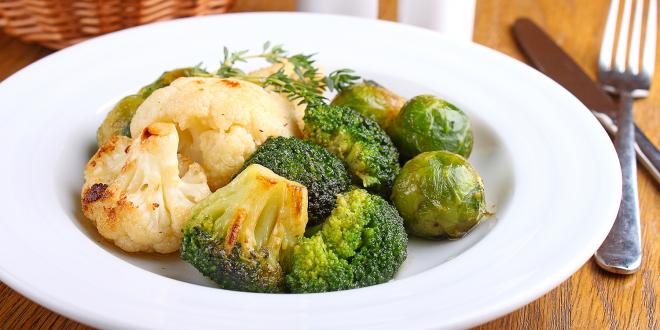 a plate of roasted cauliflower and brussels sprouts