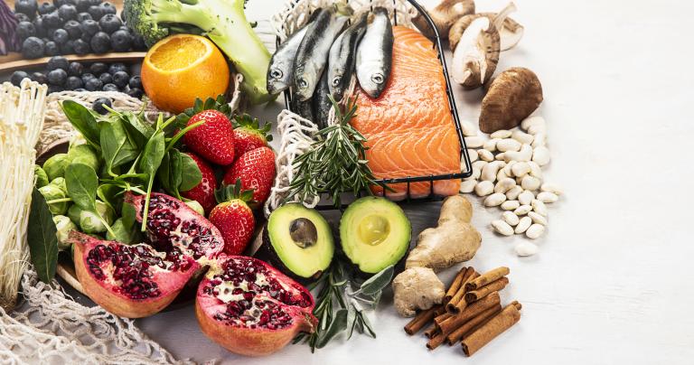 A selection of anti-inflammatory foods such as fatty fish and avocados